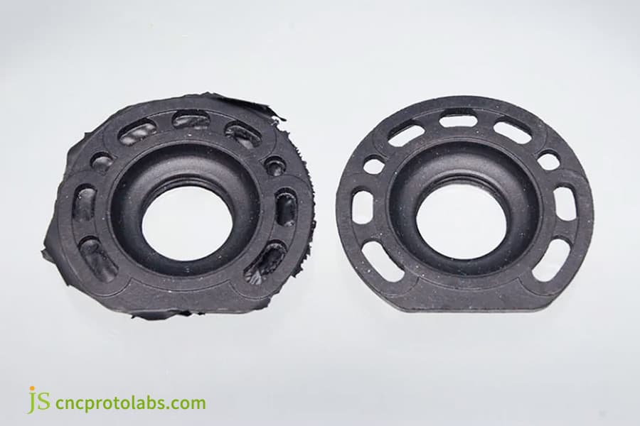 Black plastic parts with smooth and flawed edges