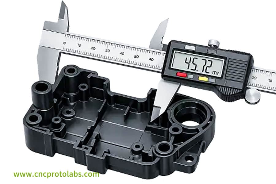 CNC caliper checks injection molding tolerances.
