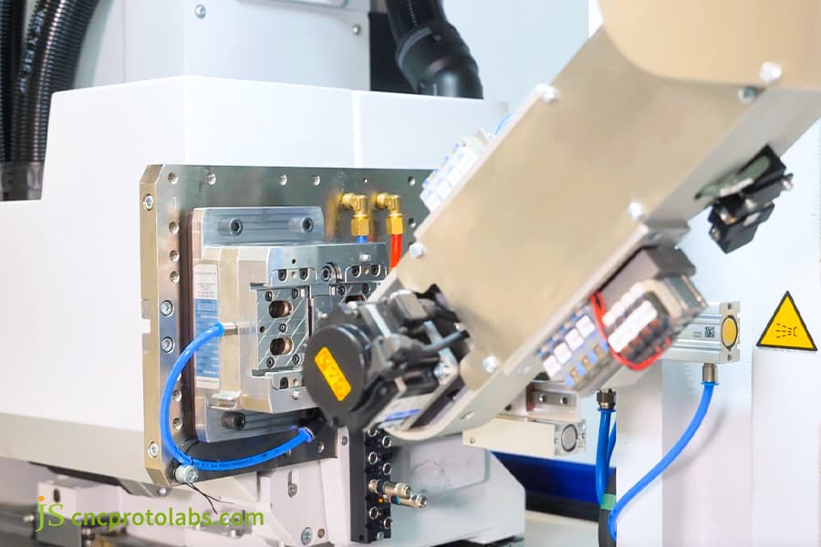 Fine-tuning a mold for precision plastic parts.