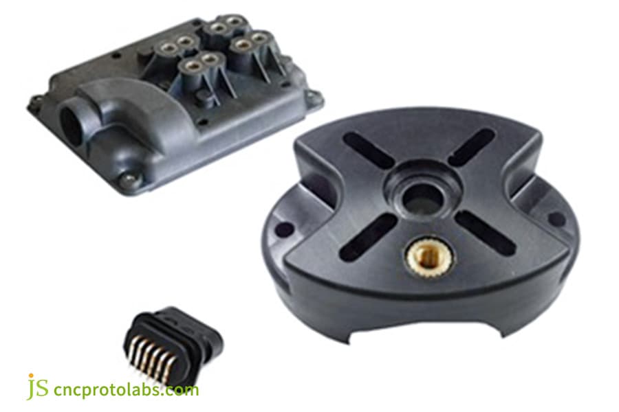Collection of insert-molded black plastic parts