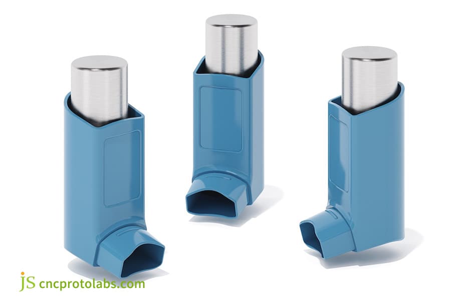 Display of three blue medical overmolded parts