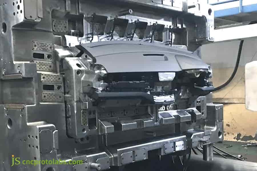 Automotive injection molding​ part demolding.
