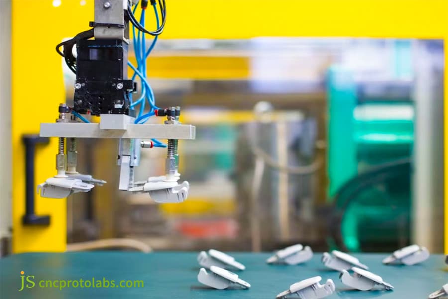 Robotic automation for handling overmolded parts