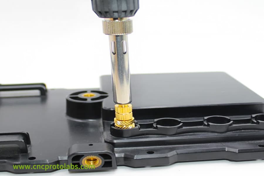 Threaded insert placement to prevent overflow