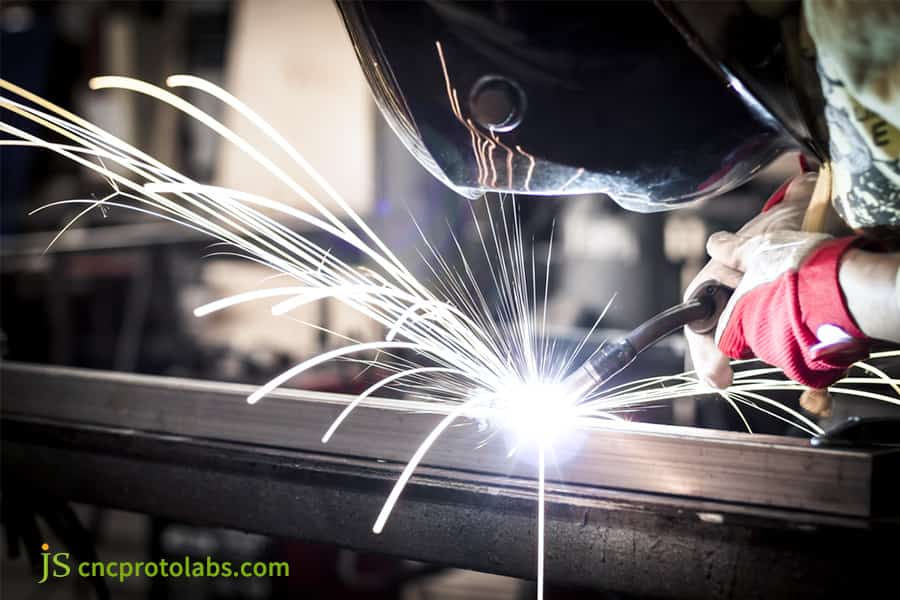 Welding finishing metal beam with sparks
